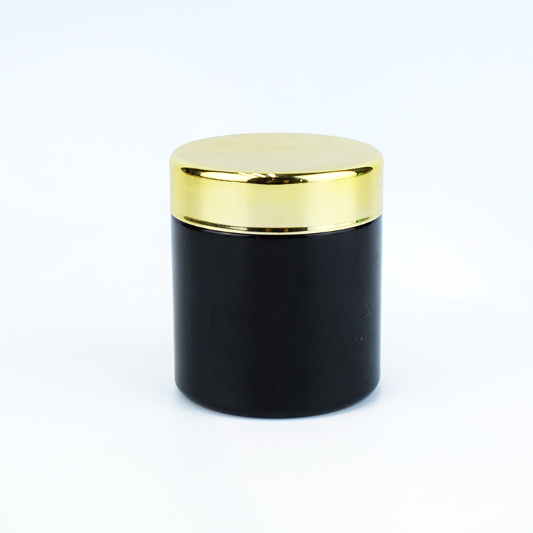 Black color child resistant glass jar with gold lid