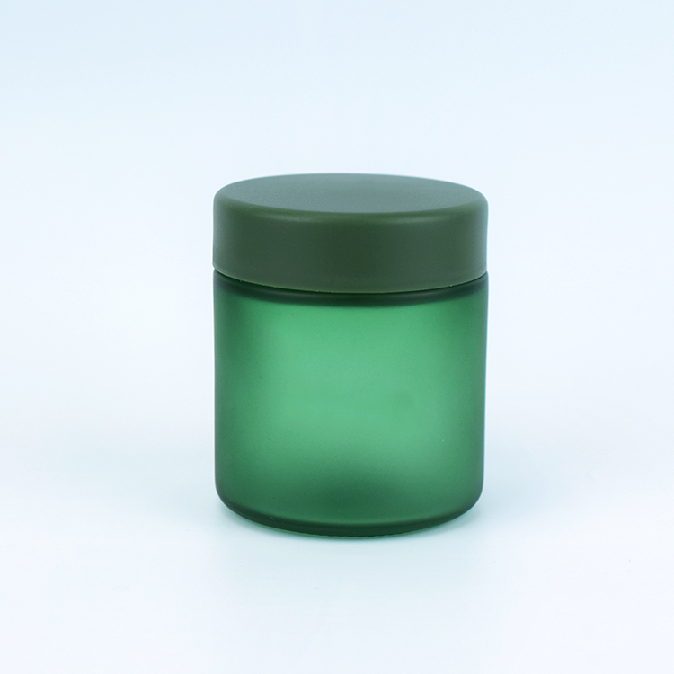 Dark green color child resistant glass jar