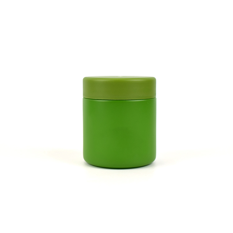 Green color child resistant glass jar