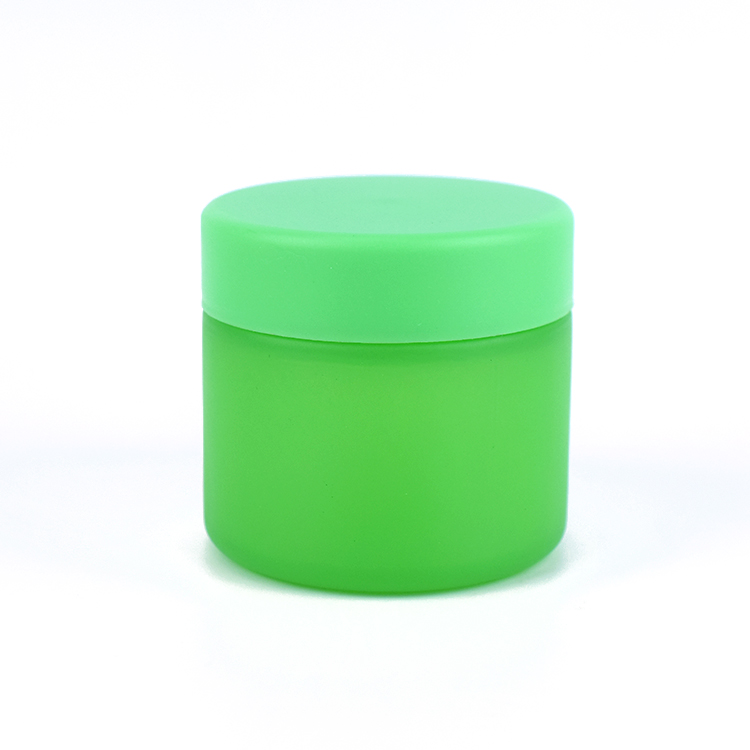 Green color child resistant glass jar